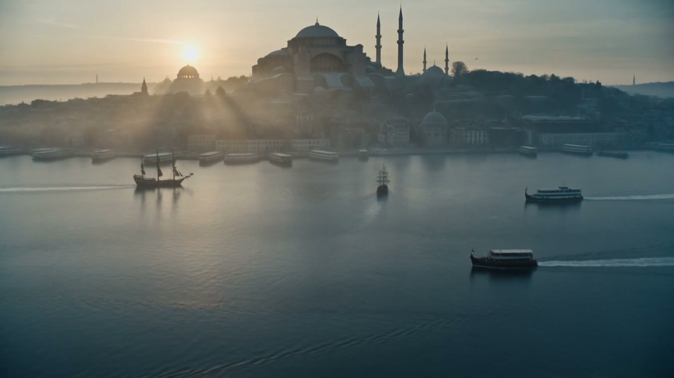 Tall ships cross the Bosphorus at dawn